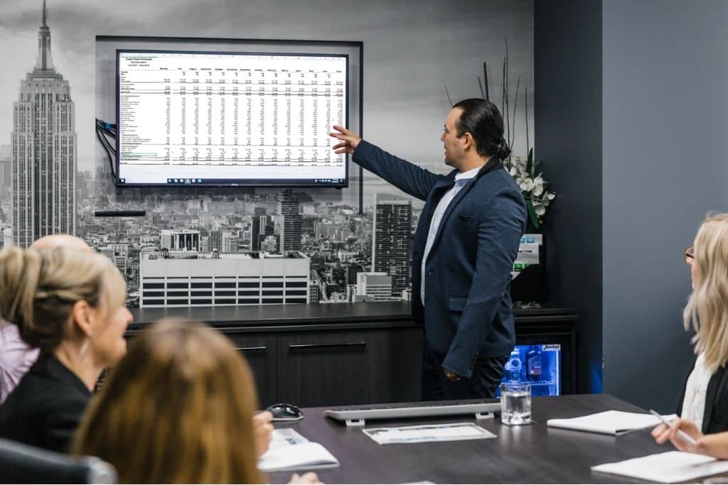 Man giving a presentation about client's business