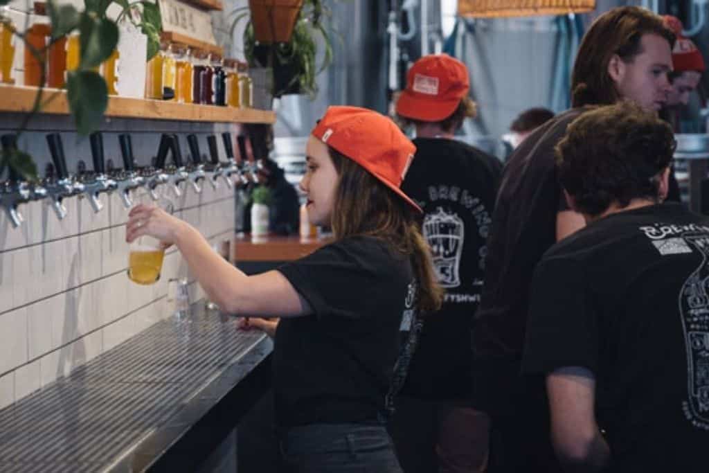 Women pouring beer in a brewery